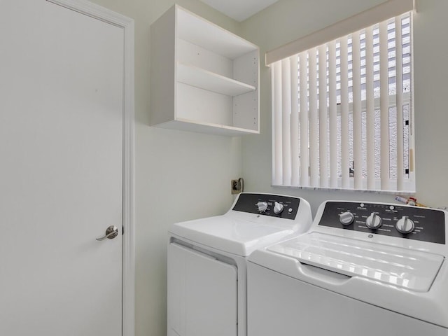 374 NW Sherry Ln, Port Saint Lucie, FL 34986 - laundry room with washing machine and clothes dryer