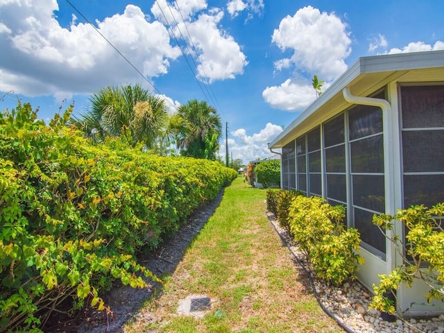 374 NW Sherry Ln, Port Saint Lucie, FL 34986 - view of yard featuring a sunroom