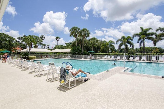 374 NW Sherry Ln, Port Saint Lucie, FL 34986 - community pool featuring a patio area