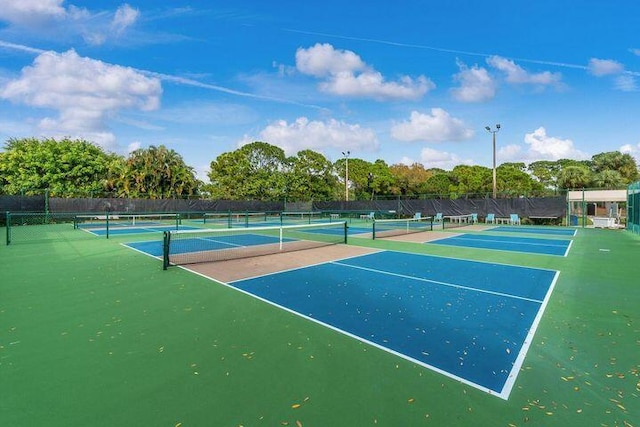 374 NW Sherry Ln, Port Saint Lucie, FL 34986 - view of tennis court with view of scattered trees