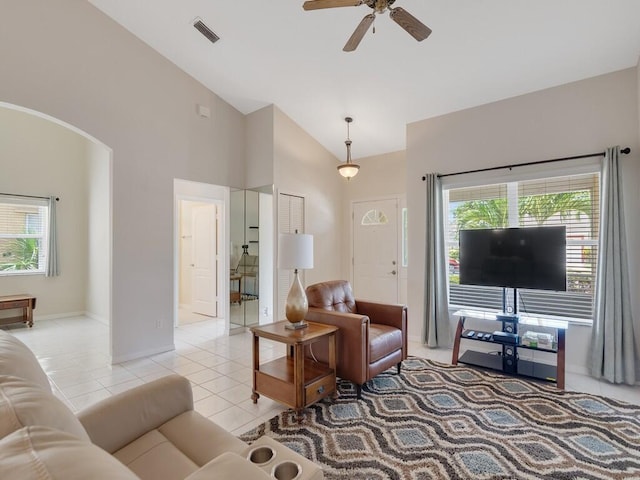374 NW Sherry Ln, Port Saint Lucie, FL 34986 - living area with ceiling fan, high vaulted ceiling, light tile patterned flooring, and arched walkways