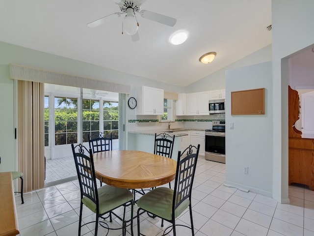 374 NW Sherry Ln, Port Saint Lucie, FL 34986 - dining space featuring lofted ceiling and a ceiling fan