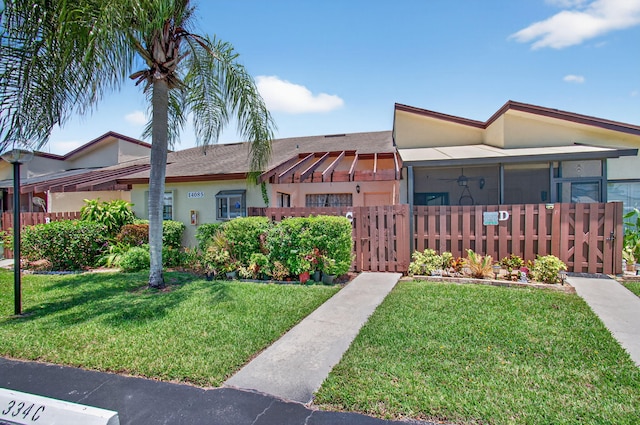 14085 Nesting Way Unit C, Delray Beach, FL 33484 - view of front of home with stucco siding and a gate