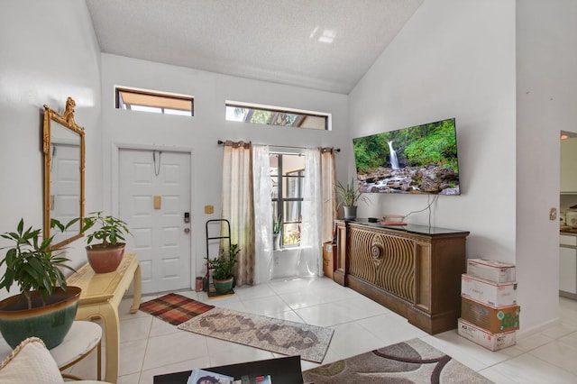 14085 Nesting Way Unit C, Delray Beach, FL 33484 - entryway featuring high vaulted ceiling, a textured ceiling, and tile patterned floors
