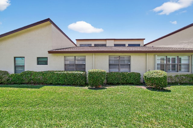 14085 Nesting Way Unit C, Delray Beach, FL 33484 - view of side of home with stucco siding and a yard