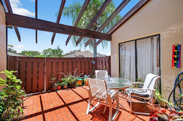 14085 Nesting Way Unit C, Delray Beach, FL 33484 - view of patio with outdoor dining area and a pergola