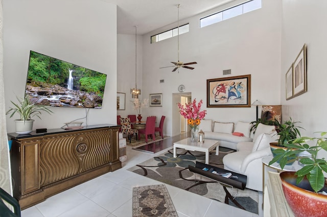 14085 Nesting Way Unit C, Delray Beach, FL 33484 - living room with a towering ceiling, light tile patterned floors, and a ceiling fan