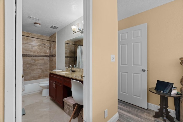 7670 NW 79th Ave Unit O3, Tamarac, FL 33321 - full bathroom featuring a textured ceiling, vanity, and shower / bathtub combination with curtain