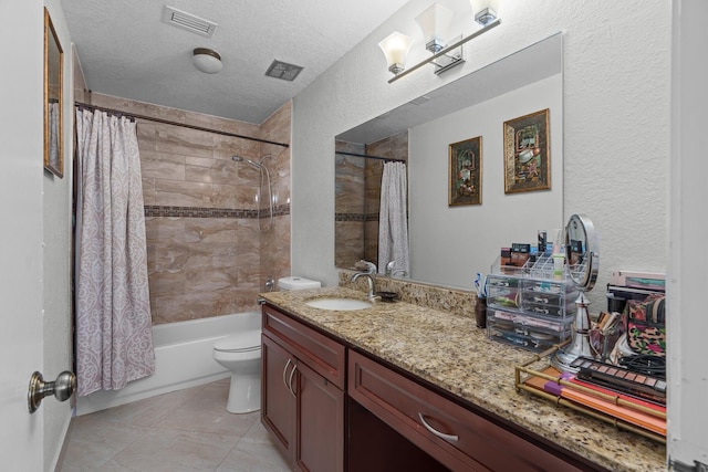 7670 NW 79th Ave Unit O3, Tamarac, FL 33321 - full bath with vanity, shower / bath combo, tile patterned flooring, a textured ceiling, and a textured wall