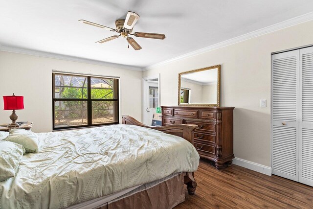 7800 Texas Trl, Boca Raton, FL 33487 - bedroom with dark wood-style flooring, crown molding, ceiling fan, and a closet