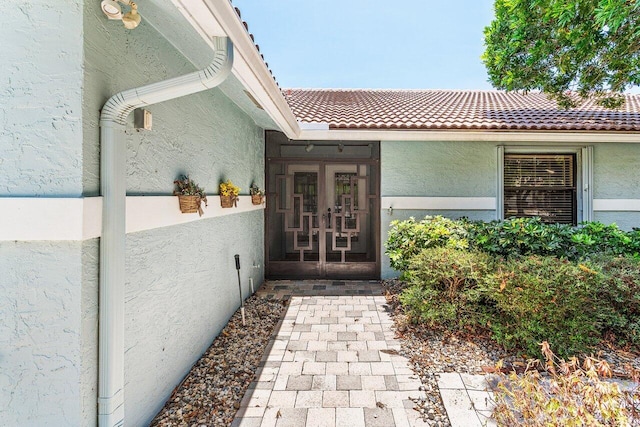 7800 Texas Trl, Boca Raton, FL 33487 - doorway to property featuring stucco siding, a tile roof, and french doors