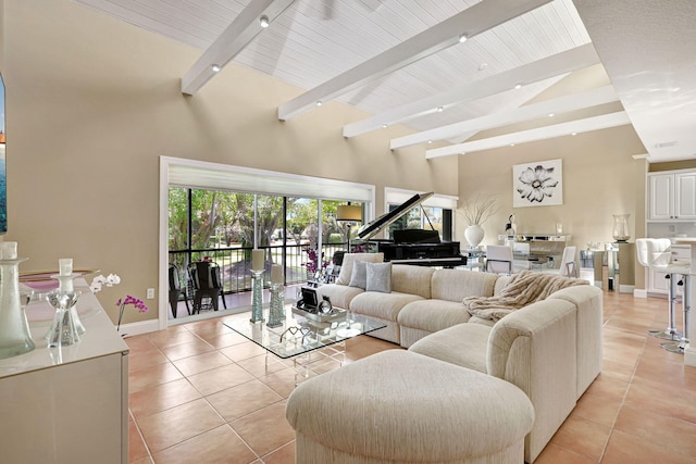 6890 Willow Wood Dr Unit 206, Boca Raton, FL 33434 - living room with light tile patterned flooring, a wood ceiling with exposed beams, high vaulted ceiling, and track lighting