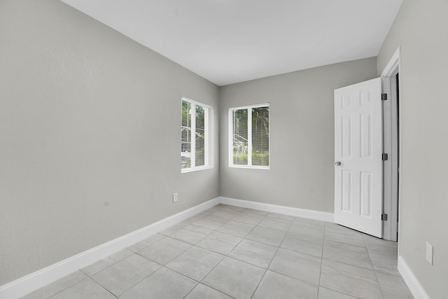 306 N N 28th St, Fort Pierce, FL 34947 - spare room featuring light tile patterned floors and baseboards