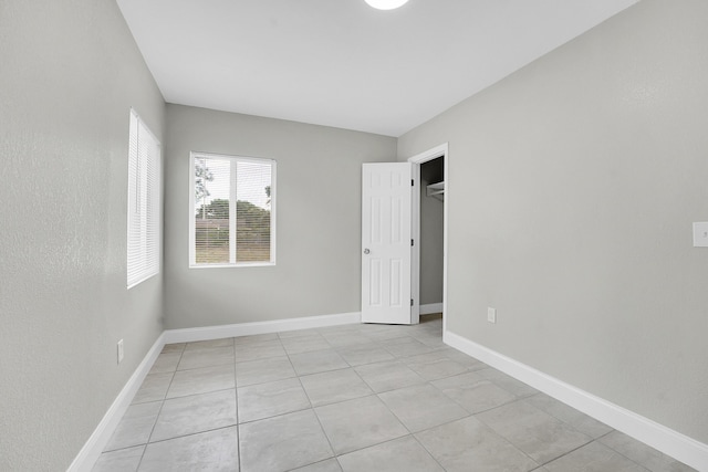 306 N N 28th St, Fort Pierce, FL 34947 - unfurnished bedroom featuring light tile patterned floors and a spacious closet
