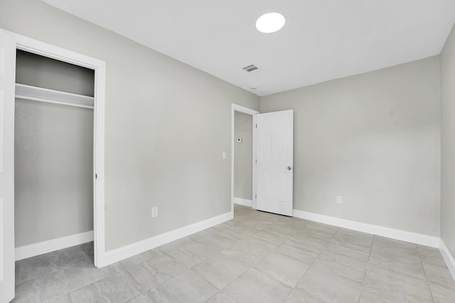 306 N N 28th St, Fort Pierce, FL 34947 - unfurnished bedroom with baseboards and a closet