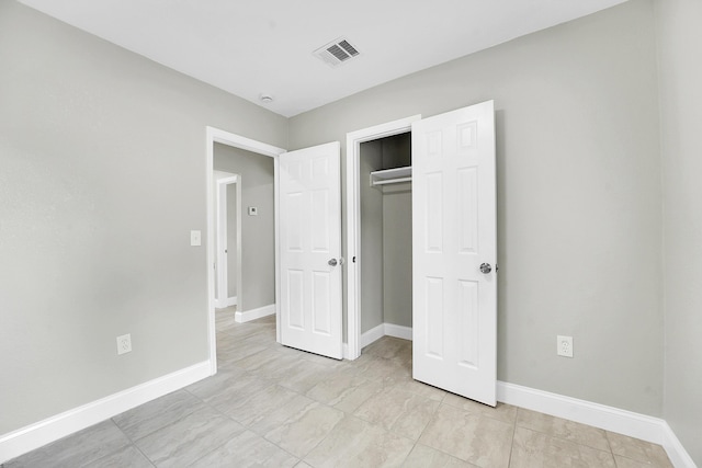 306 N N 28th St, Fort Pierce, FL 34947 - unfurnished bedroom featuring a closet and light tile patterned floors