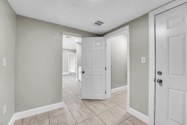 306 N N 28th St, Fort Pierce, FL 34947 - corridor featuring light tile patterned floors and baseboards