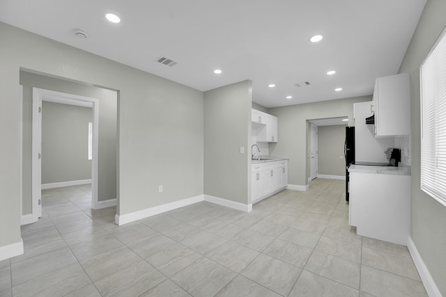 306 N N 28th St, Fort Pierce, FL 34947 - unfurnished living room with light tile patterned floors and recessed lighting