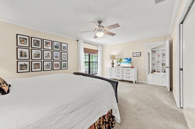 11265 Bannock Ave Unit 5, Boynton Beach, FL 33437 - bedroom with a textured ceiling, crown molding, light carpet, and ceiling fan
