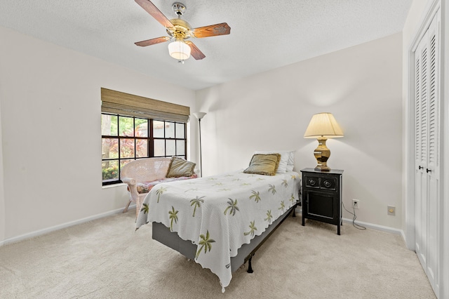 11265 Bannock Ave Unit 5, Boynton Beach, FL 33437 - bedroom with a closet, carpet floors, a ceiling fan, and a textured ceiling