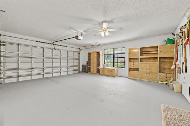 11265 Bannock Ave Unit 5, Boynton Beach, FL 33437 - garage featuring a garage door opener and a ceiling fan