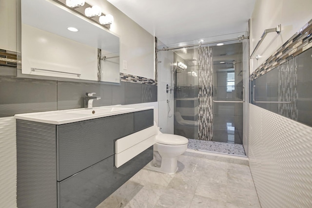 3600 NE 170th St Unit 407, North Miami Beach, FL 33160 - full bathroom featuring a stall shower, vanity, and tile walls