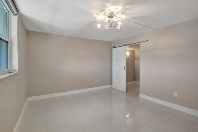 3600 NE 170th St Unit 407, North Miami Beach, FL 33160 - empty room with a barn door, a chandelier, and light tile patterned floors