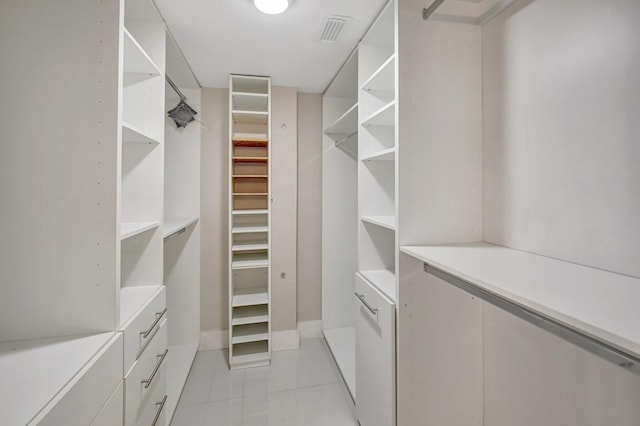 3600 NE 170th St Unit 407, North Miami Beach, FL 33160 - walk in closet with light tile patterned flooring