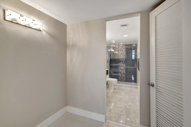 3600 NE 170th St Unit 407, North Miami Beach, FL 33160 - full bathroom featuring a stall shower and tile patterned flooring