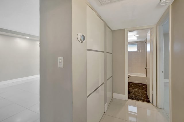 3600 NE 170th St Unit 407, North Miami Beach, FL 33160 - corridor with light tile patterned flooring