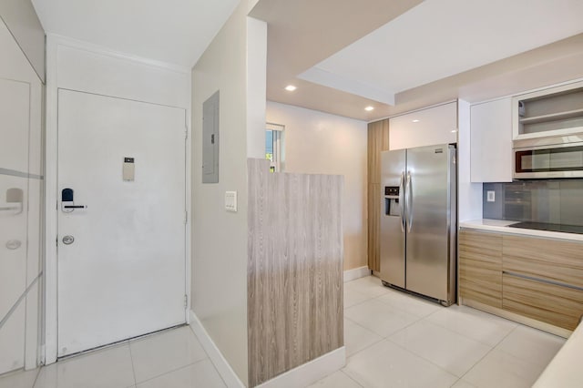 3600 NE 170th St Unit 407, North Miami Beach, FL 33160 - kitchen with appliances with stainless steel finishes, electric panel, modern cabinets, light tile patterned flooring, and recessed lighting