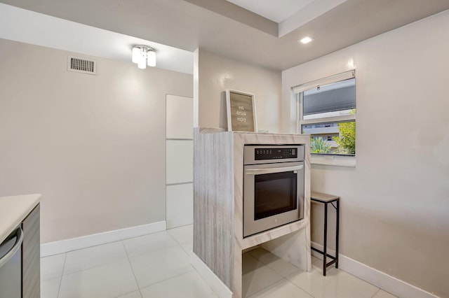3600 NE 170th St Unit 407, North Miami Beach, FL 33160 - kitchen featuring appliances with stainless steel finishes, recessed lighting, modern cabinets, and light countertops