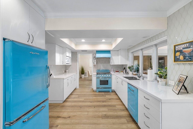 881 Elderberry Way, Boca Raton, FL 33486 - kitchen featuring fridge, high end stove, dishwasher, white cabinets, and ornamental molding
