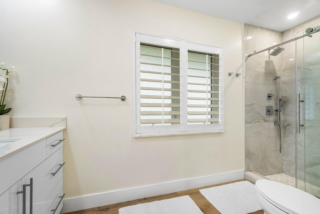881 Elderberry Way, Boca Raton, FL 33486 - full bathroom featuring a marble finish shower, vanity, wood finished floors, and healthy amount of natural light