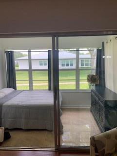 14572 Canalview Dr Unit C, Delray Beach, FL 33484 - bedroom with wood finished floors and baseboards