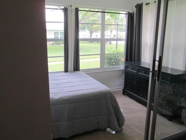 14572 Canalview Dr Unit C, Delray Beach, FL 33484 - bedroom with tile patterned flooring