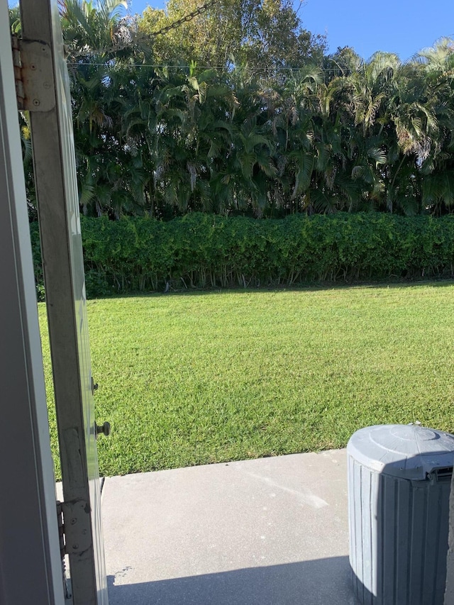 14572 Canalview Dr Unit C, Delray Beach, FL 33484 - view of green lawn with a patio