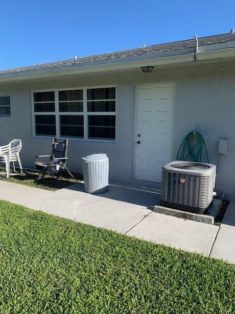 14572 Canalview Dr Unit C, Delray Beach, FL 33484 - view of exterior entry with stucco siding