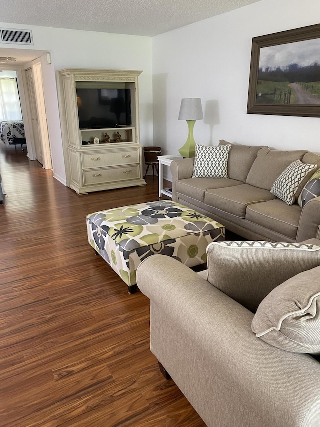 14572 Canalview Dr Unit C, Delray Beach, FL 33484 - living area with dark wood-type flooring and a textured ceiling