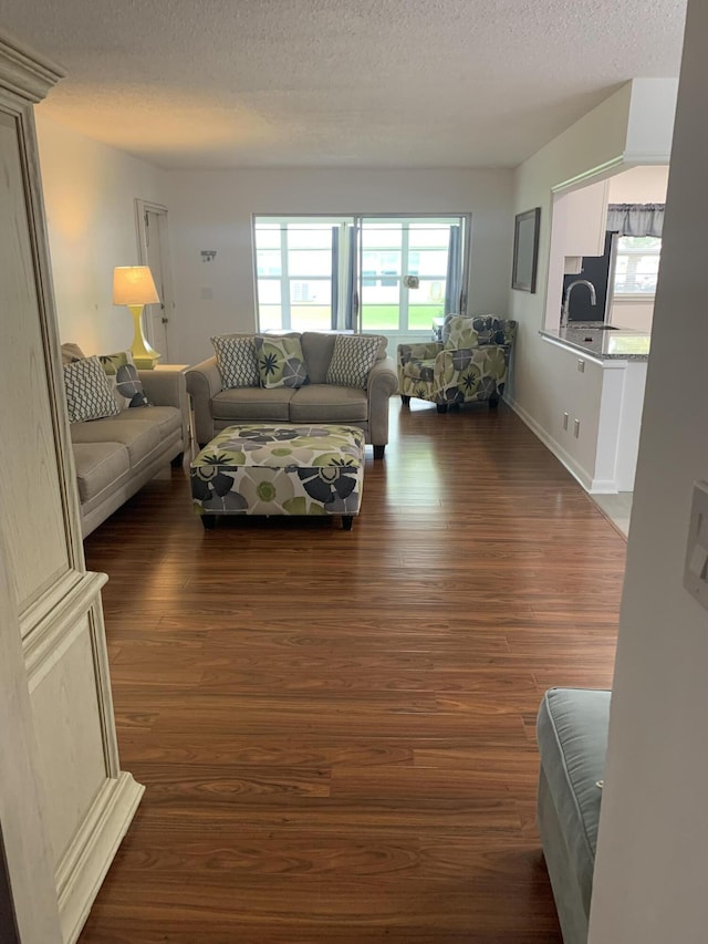 14572 Canalview Dr Unit C, Delray Beach, FL 33484 - living area featuring wood finished floors and a textured ceiling