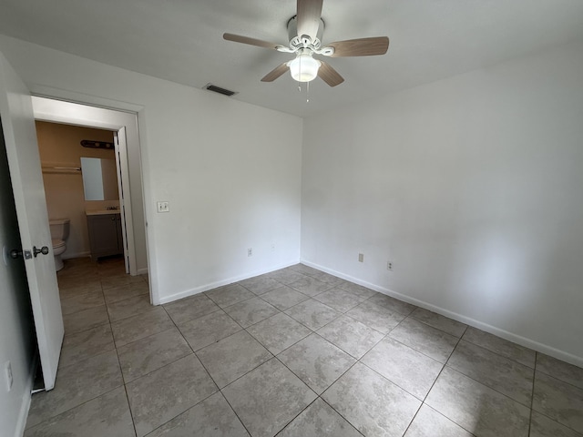 2564 Navajo Ave, Fort Pierce, FL 34946 - spare room featuring light tile patterned flooring and ceiling fan