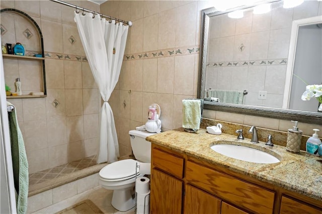 2582 Longwood Blvd, Melbourne, FL 32934 - bathroom featuring tile walls, vanity, a tile shower, backsplash, and tile patterned floors