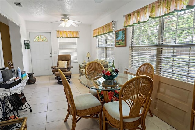 2582 Longwood Blvd, Melbourne, FL 32934 - dining area with a ceiling fan and light tile patterned flooring