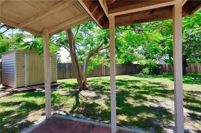 2582 Longwood Blvd, Melbourne, FL 32934 - fenced backyard with a storage shed and a patio