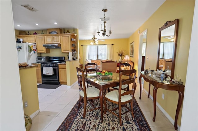 2582 Longwood Blvd, Melbourne, FL 32934 - dining room with a ceiling fan, light tile patterned floors, a chandelier, and recessed lighting