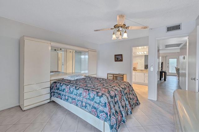 1902 Bermuda Cir Unit L2, Coconut Creek, FL 33066 - bedroom with light tile patterned floors, ensuite bath, and ceiling fan