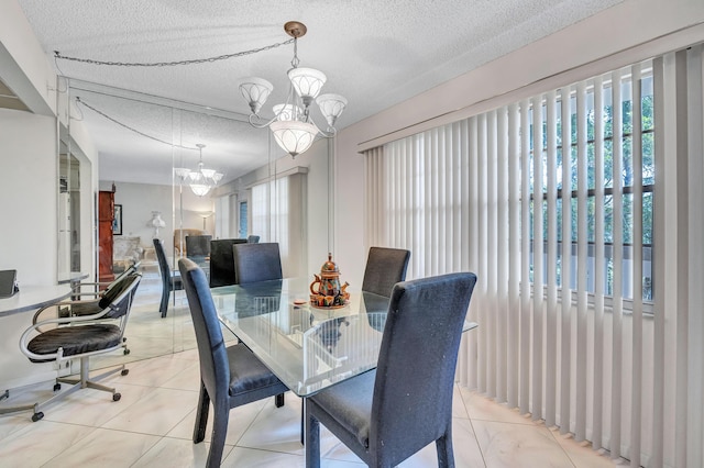 1902 Bermuda Cir Unit L2, Coconut Creek, FL 33066 - dining area with a chandelier and a textured ceiling