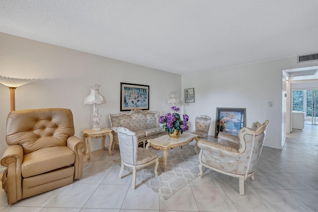 1902 Bermuda Cir Unit L2, Coconut Creek, FL 33066 - living room with tile patterned flooring and a textured ceiling