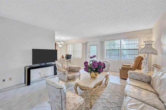 1902 Bermuda Cir Unit L2, Coconut Creek, FL 33066 - living room with light tile patterned floors, a chandelier, and a textured ceiling