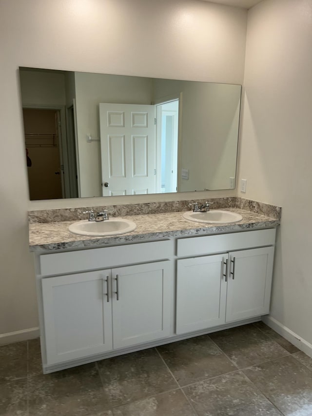 10574 SW Jem St, Port Saint Lucie, FL 34987 - full bath featuring double vanity and baseboards